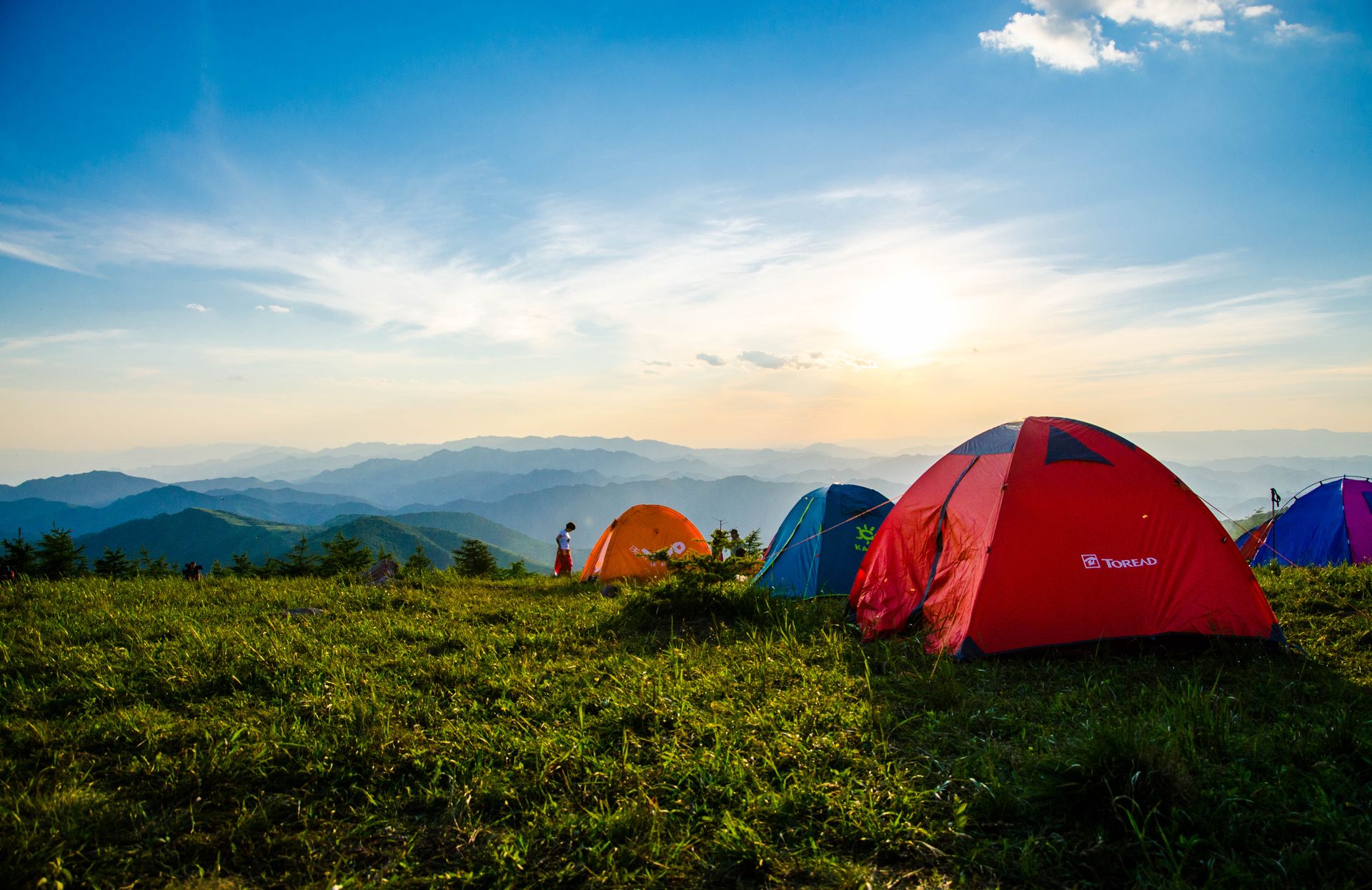 Tents at a mountain campsite at sunset