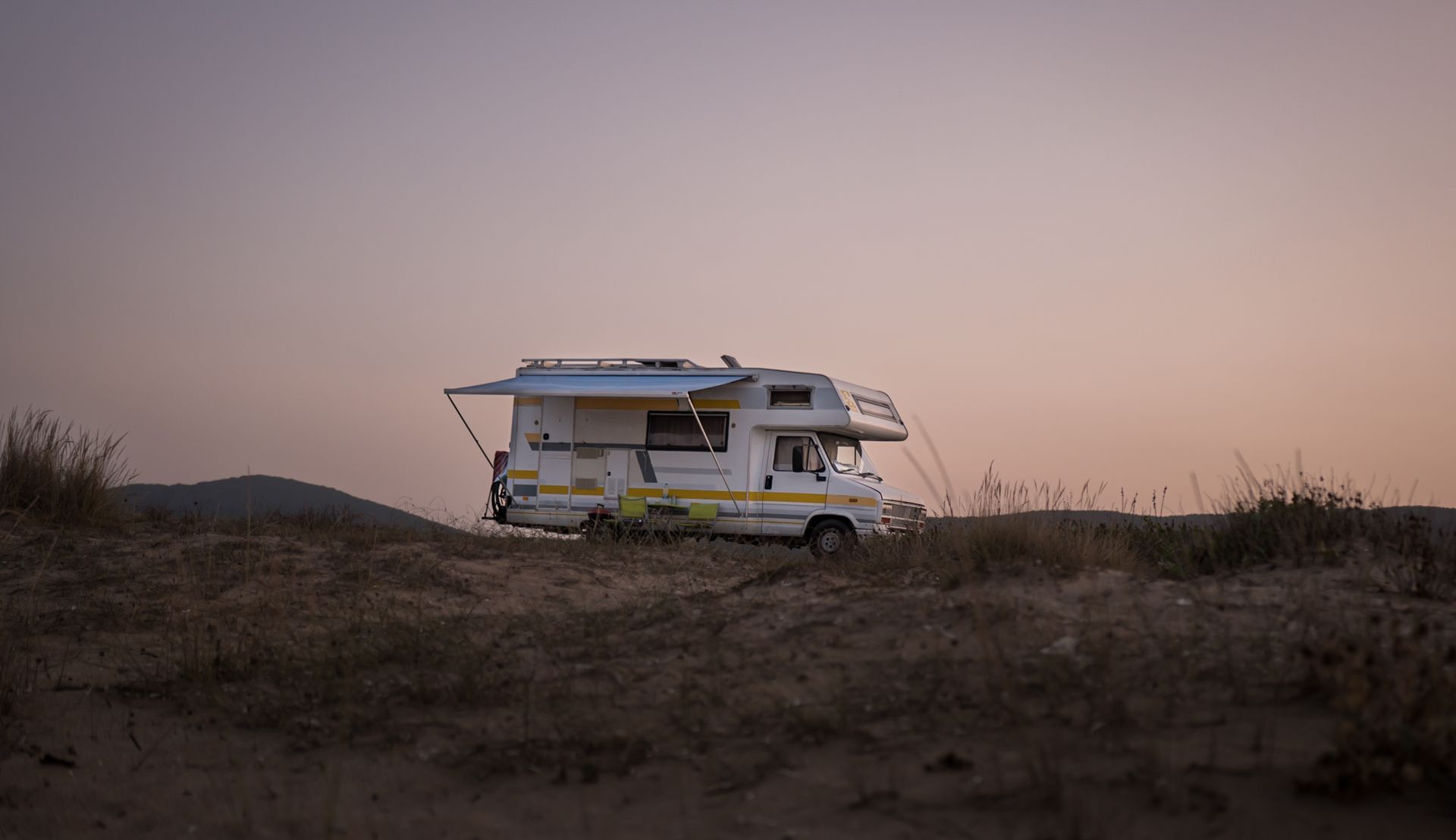 Motorhome RV parked at sunset