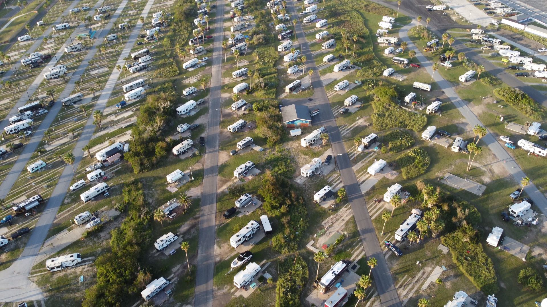 Aerial view of an RV park filled with motorhomes and trailers